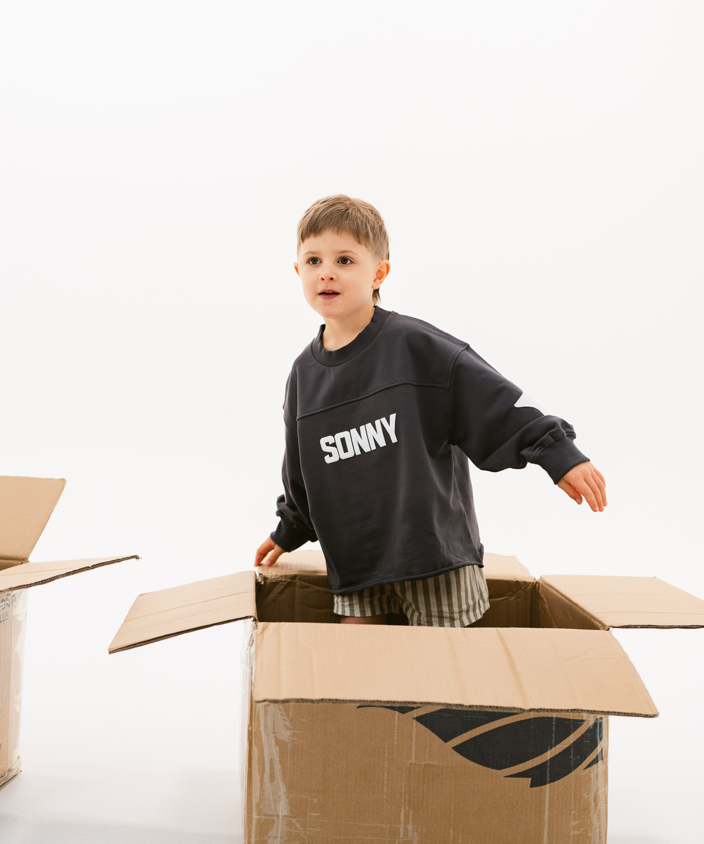 Kids retro sweatshirt in Charcoal with appliqué elbows and frayed hem by Sonny Label