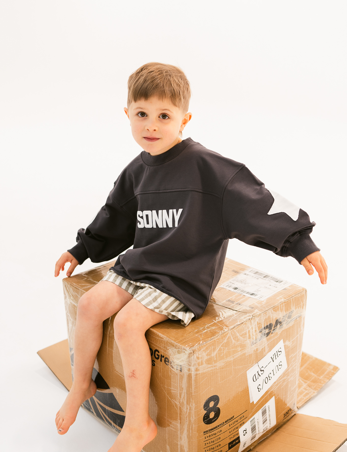 Kids retro sweatshirt in Charcoal with appliqué elbows and frayed hem by Sonny Label