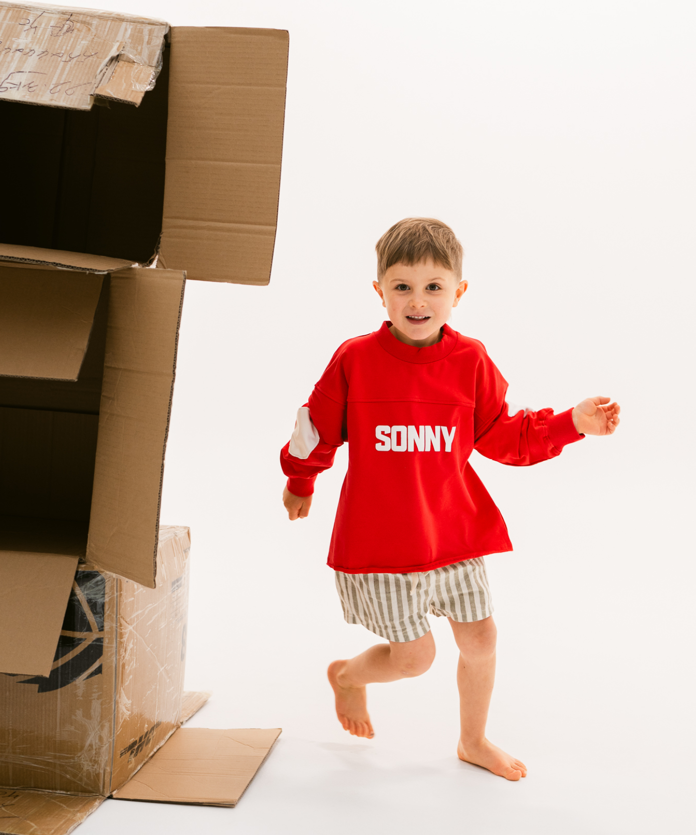 Kids retro sweatshirt in Cherry red with appliqué elbows and frayed hem by Sonny Label