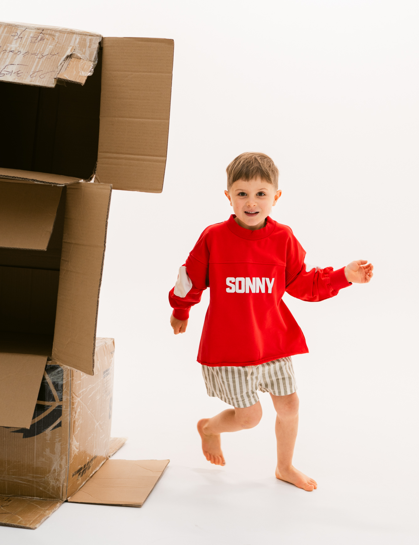 Kids retro sweatshirt in Cherry red with appliqué elbows and frayed hem by Sonny Label