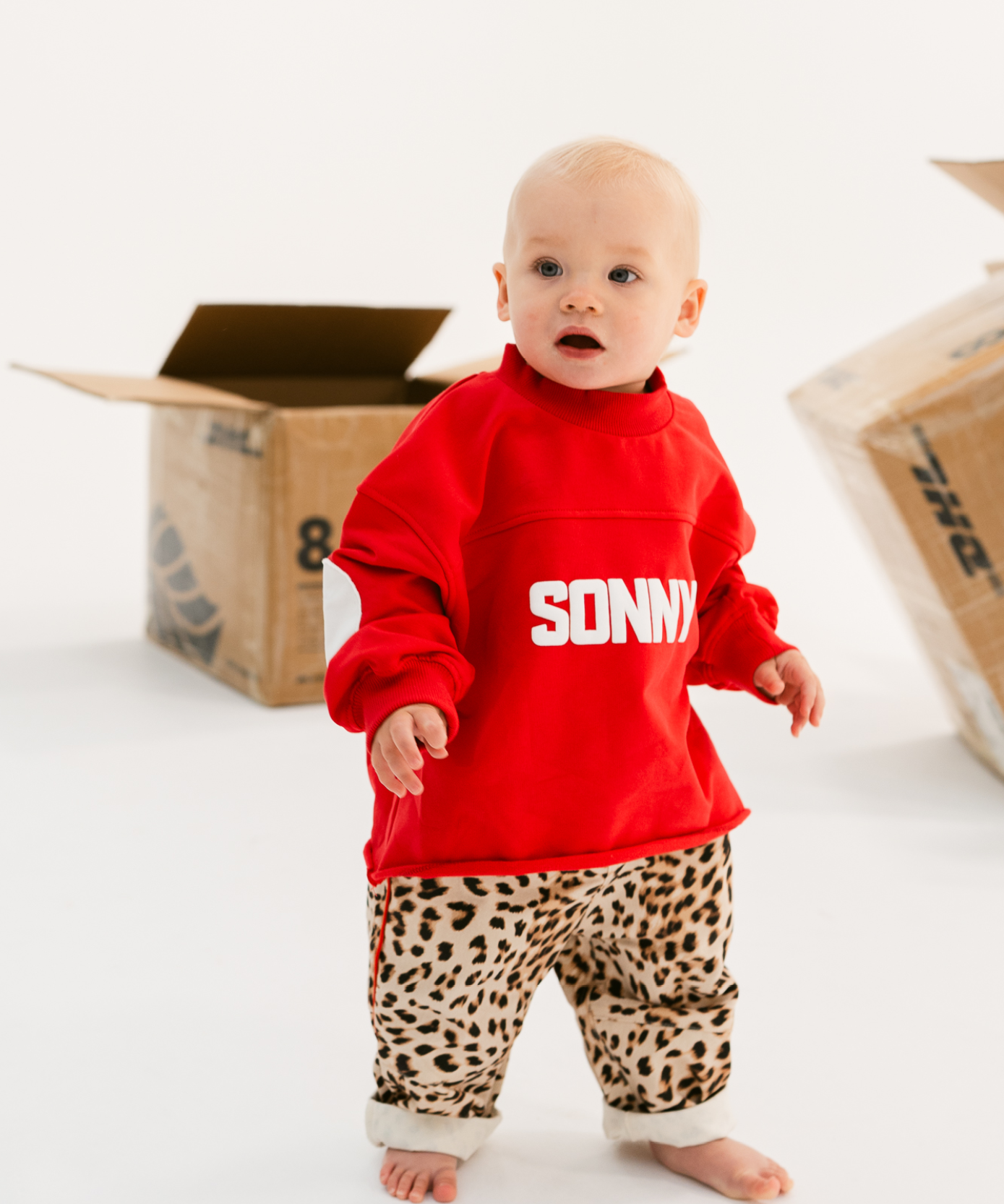 Kids retro sweatshirt in Cherry red with appliqué elbows and frayed hem by Sonny Label