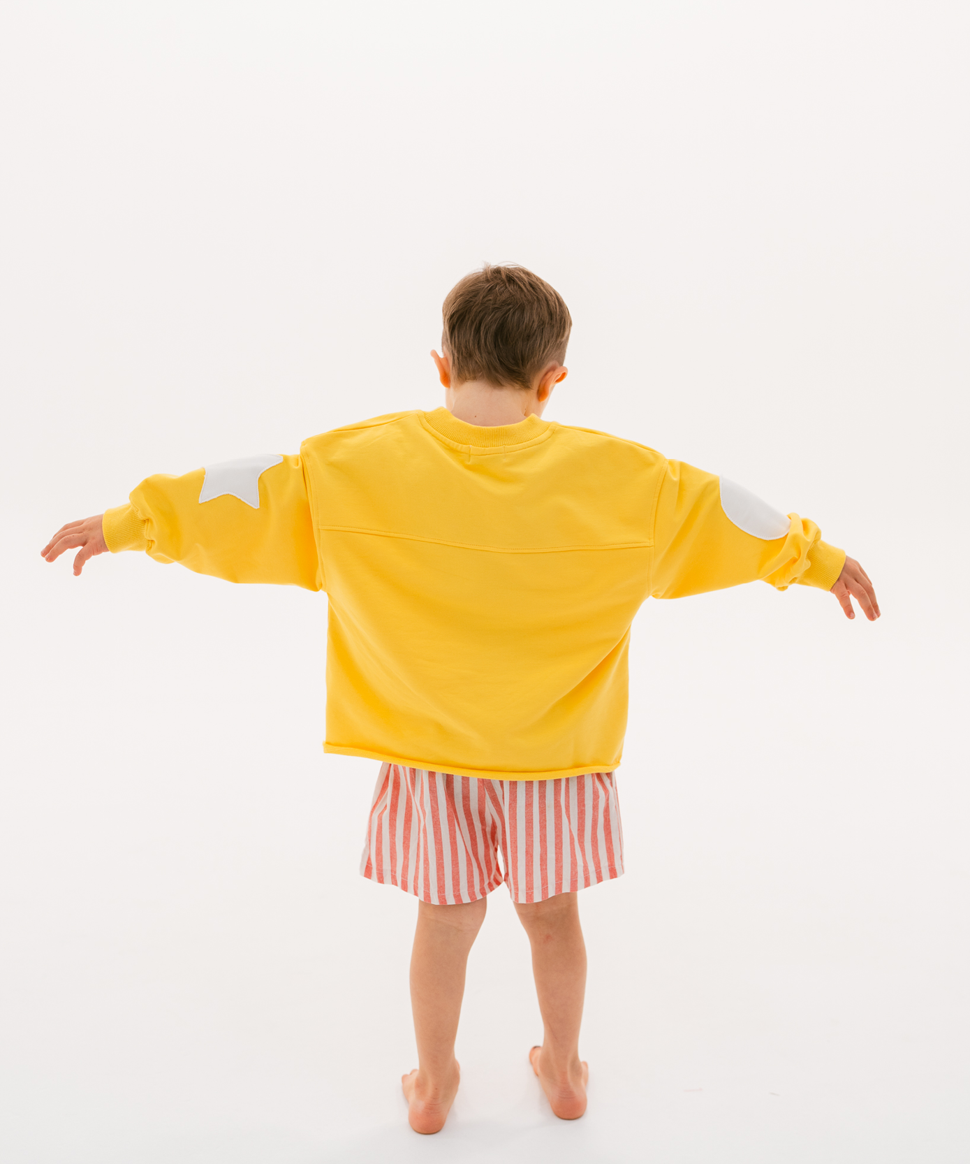 Kids retro sweatshirt in Sunshine yellow with appliqué elbows and frayed hem by Sonny Label