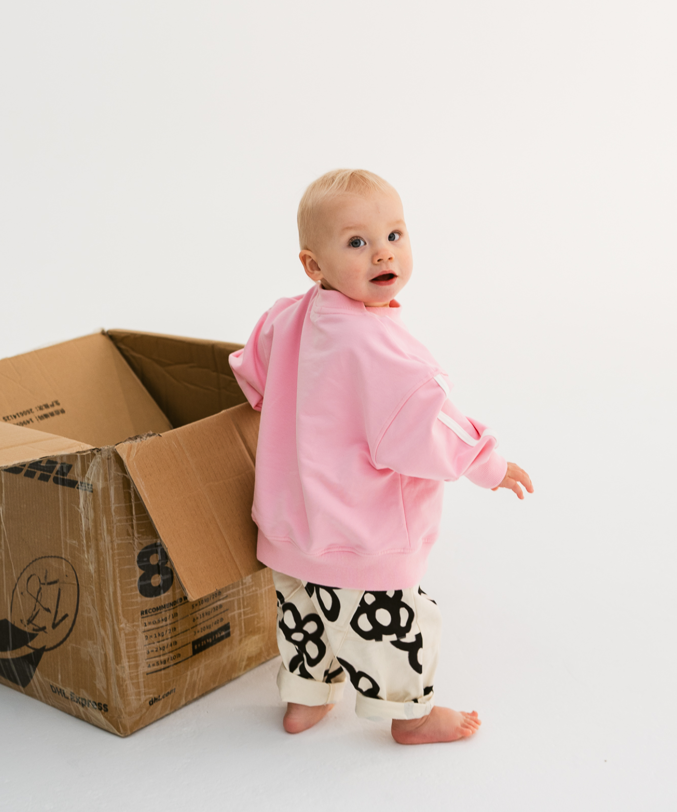 Kids sloppy joe jumper in Flamingo pink with embroidered Sonny logo