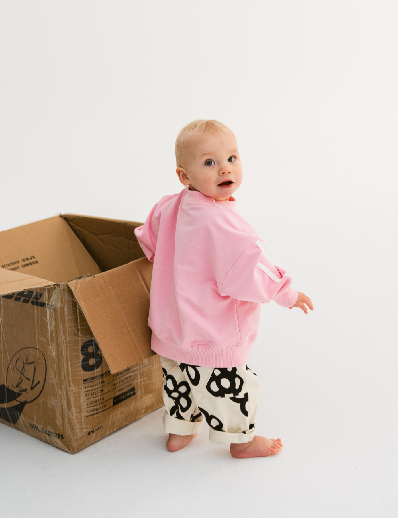 Kids sloppy joe jumper in Flamingo pink with embroidered Sonny logo