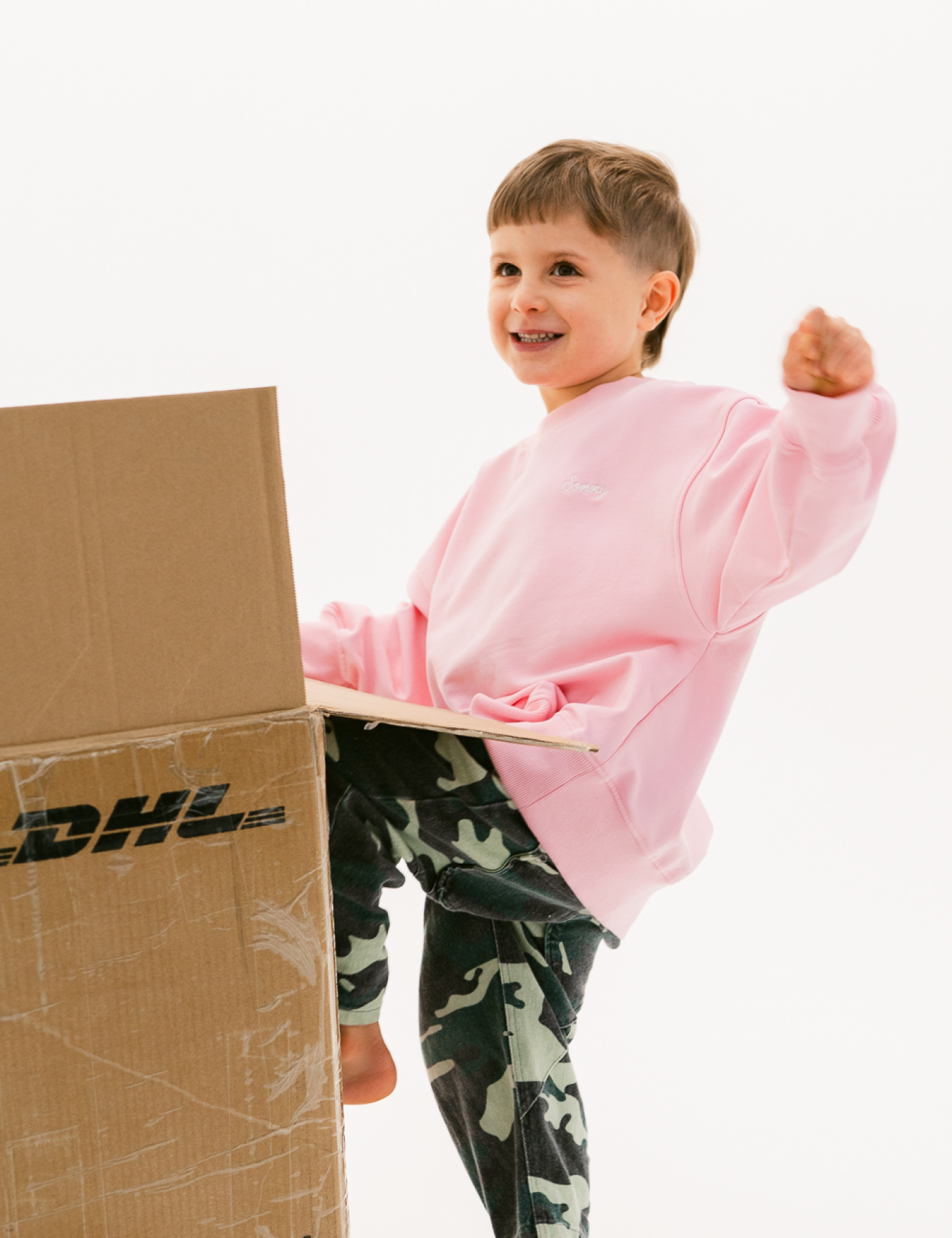 Kids sloppy joe jumper in Flamingo pink with embroidered Sonny logo