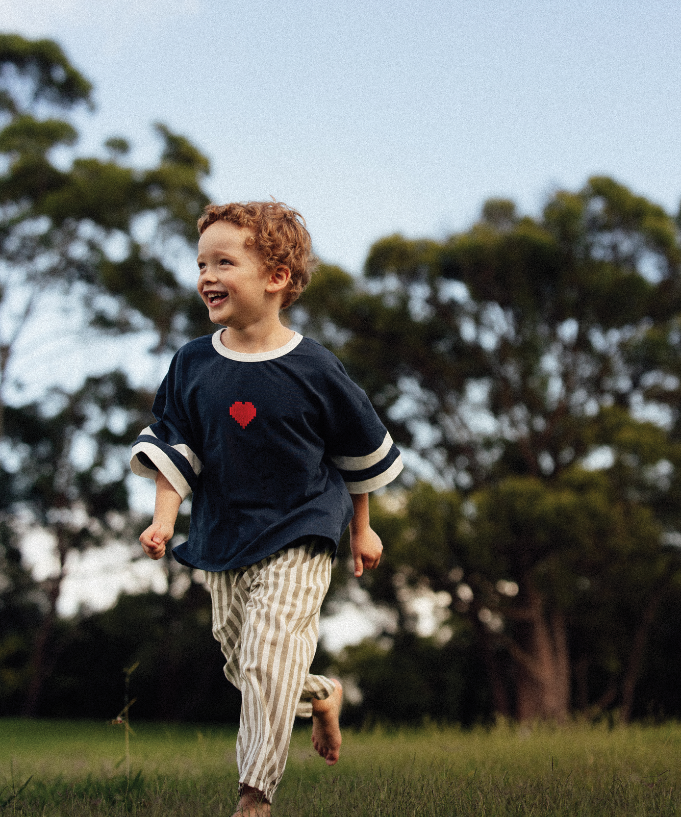 Child wearing a Sonny Label SonnyFaves collection piece in a lifestyle shot.