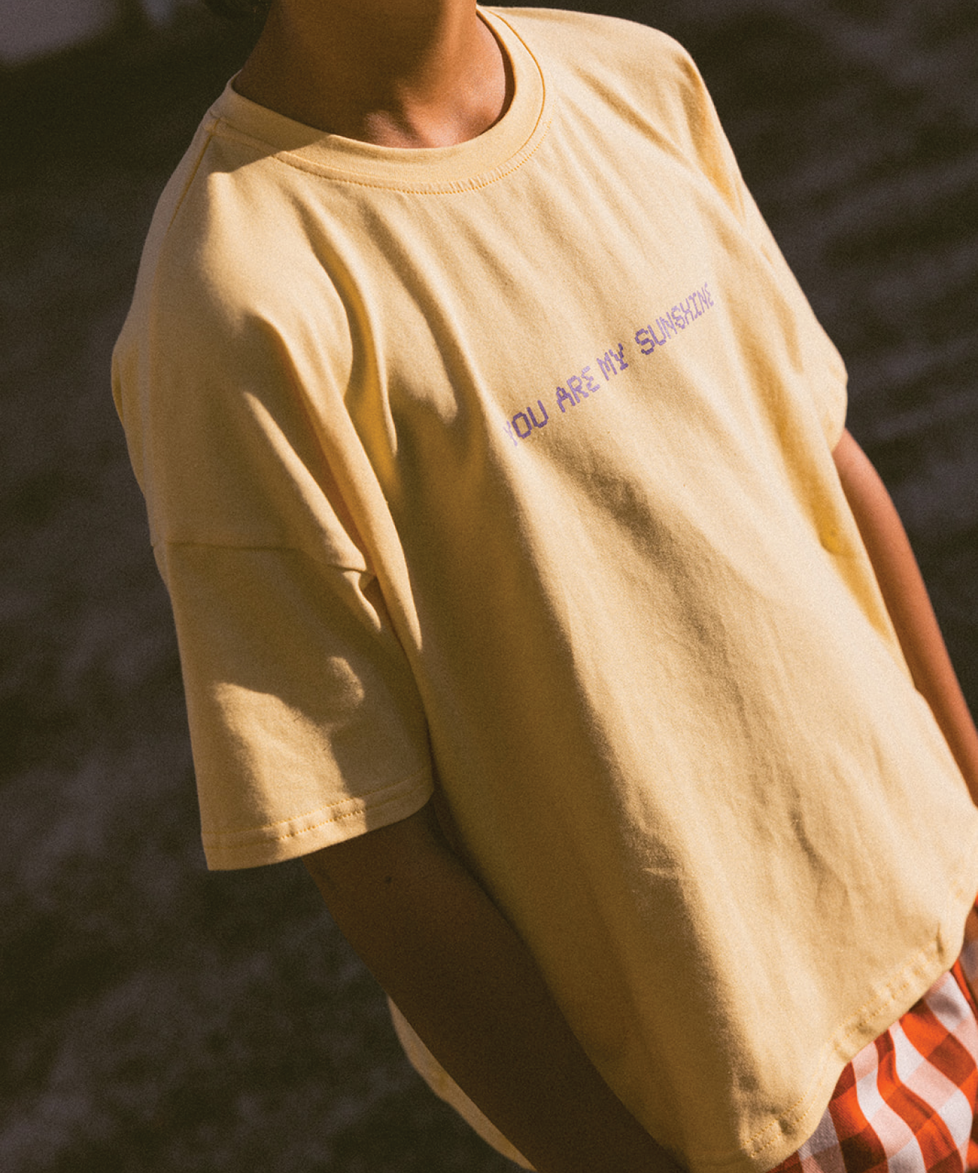 Child in a Sonny Label SonnyFaves everyday tee in a bright lifestyle shot.