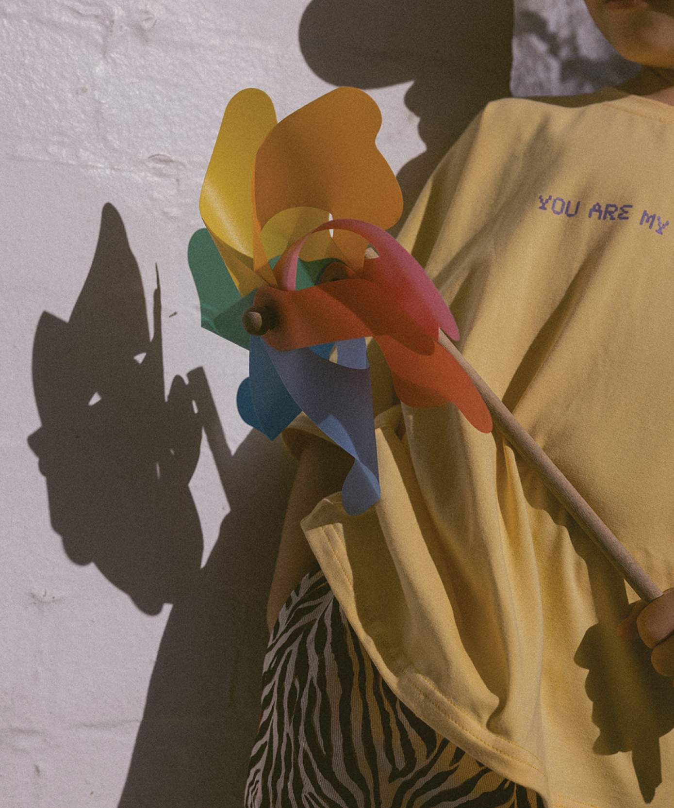 Child in a Sonny Label SonnyFaves graphic tee in a lifestyle shot.