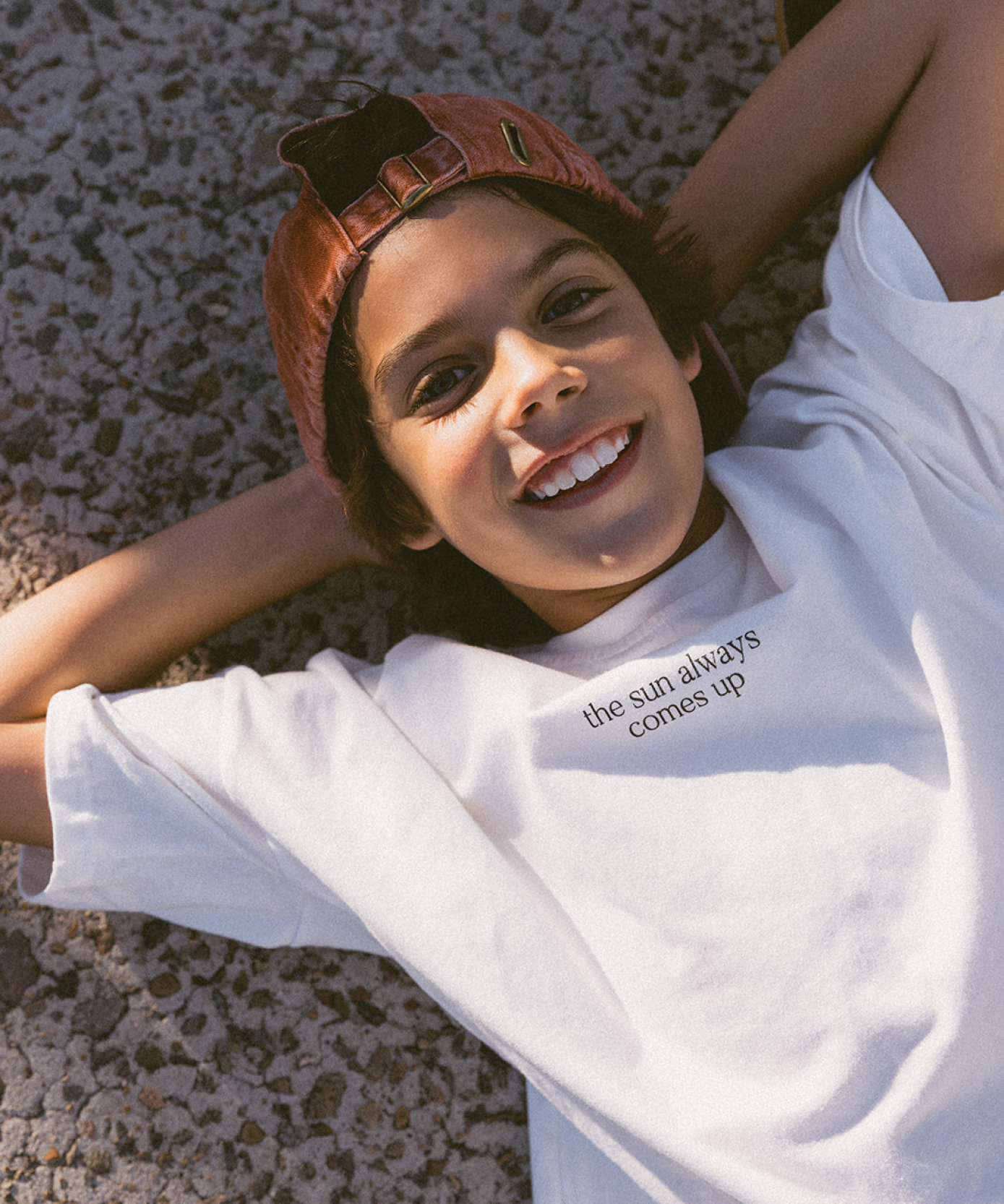 Child in a Sonny Label SonnyFaves tee in a colourful lifestyle campaign image.