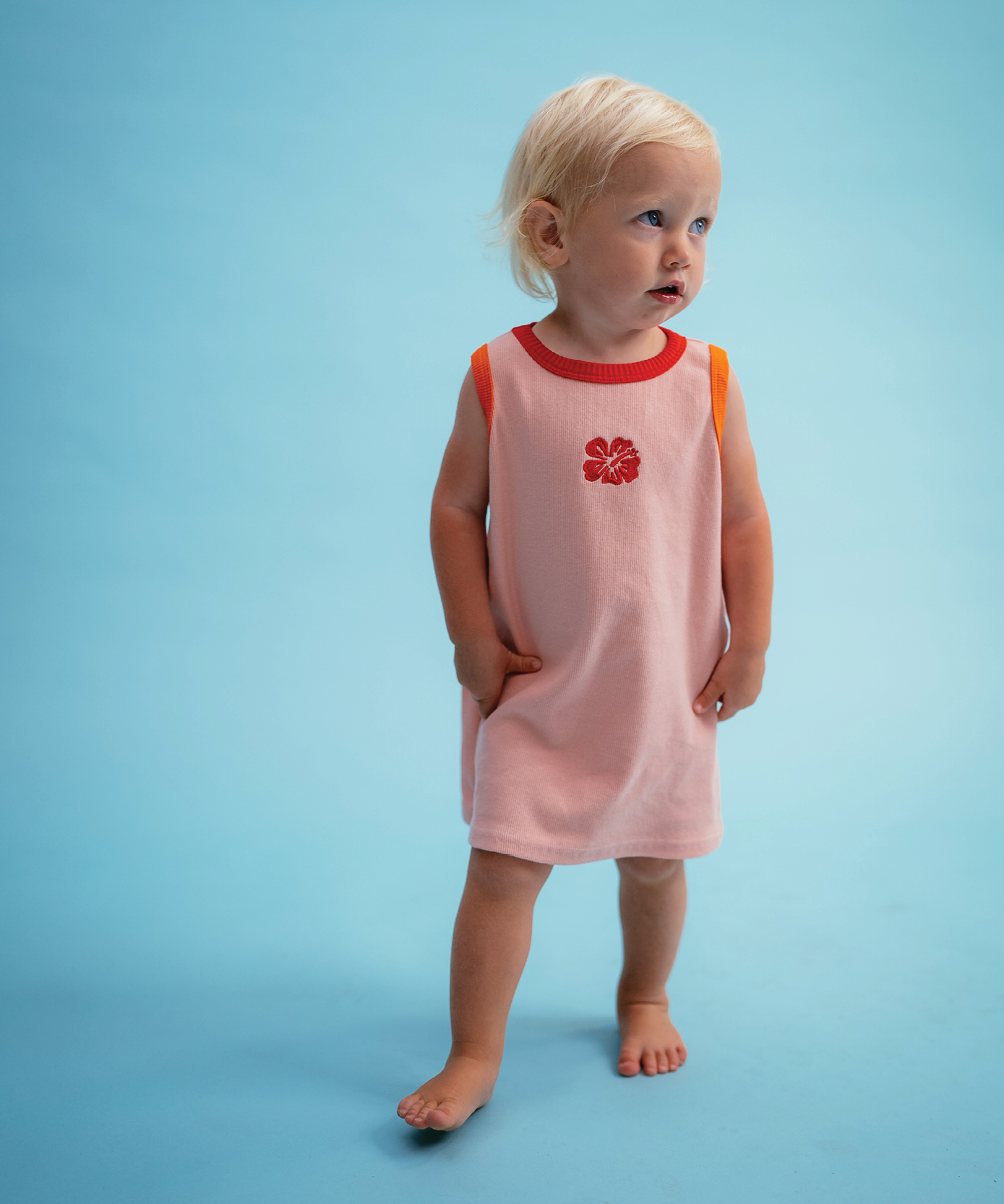 Child wearing Sonny Label Summer25 paisley shorties and sport tee on a sky blue background.