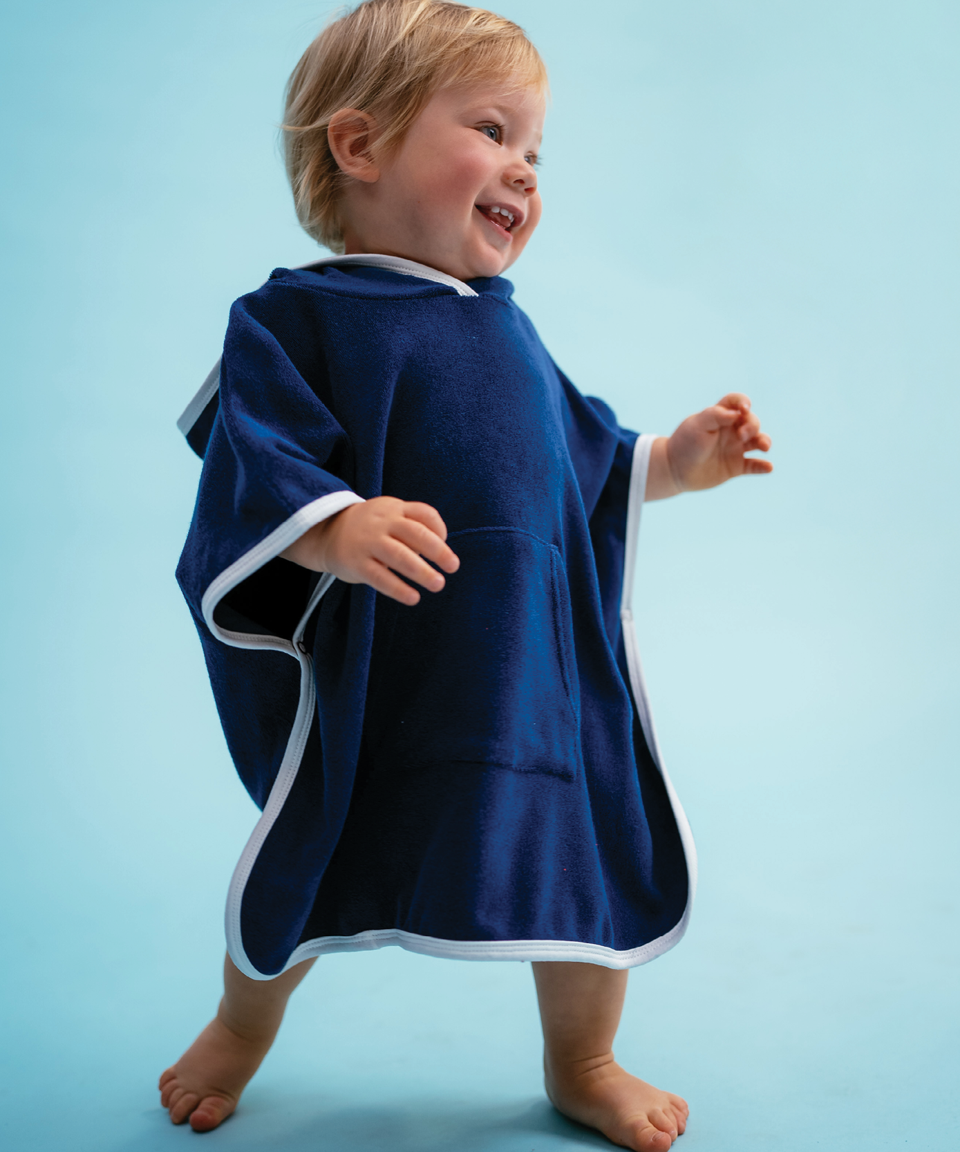 Child in Sonny Label Summer25 summer collection pieces on a sky blue background.