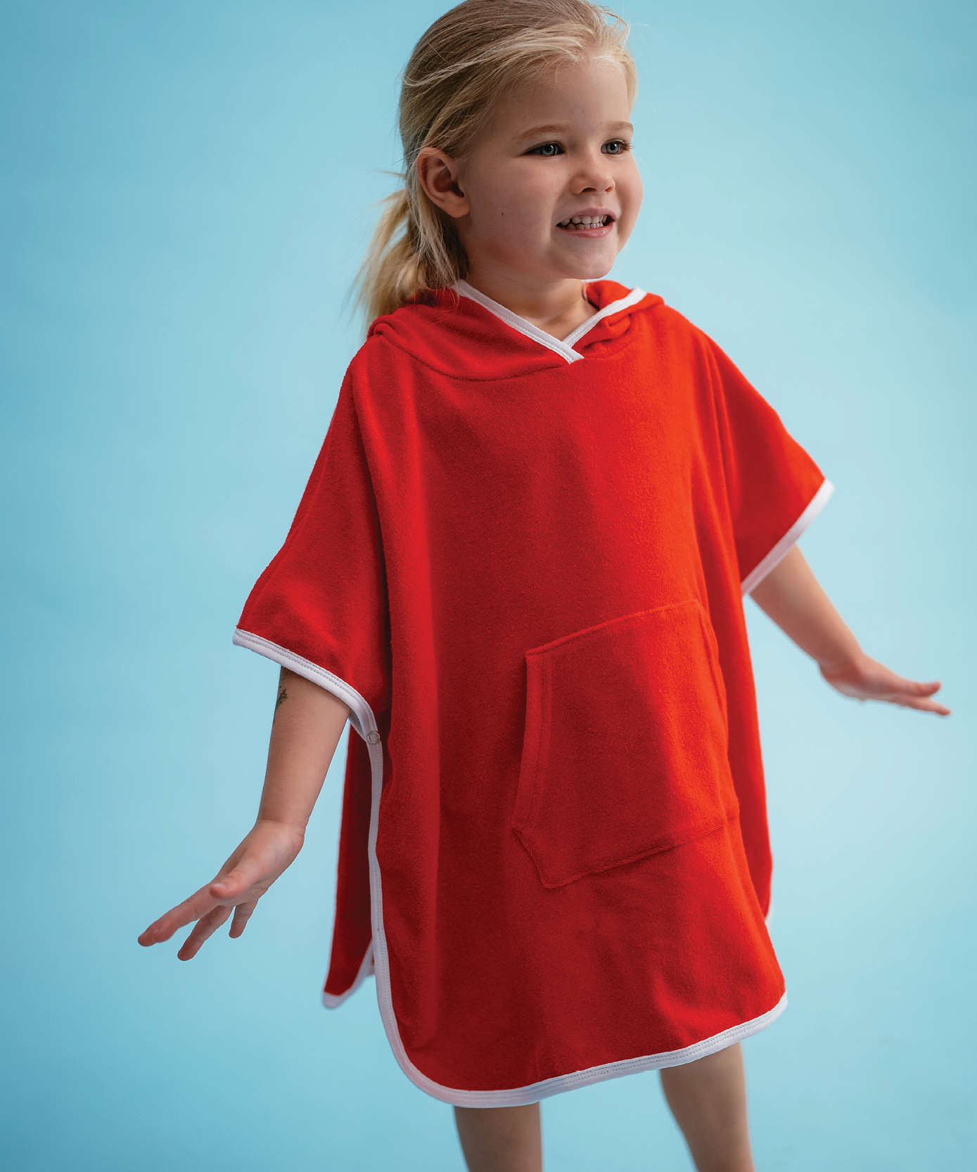 Child wearing Sonny Label Summer25 collection pieces on a sky blue background.