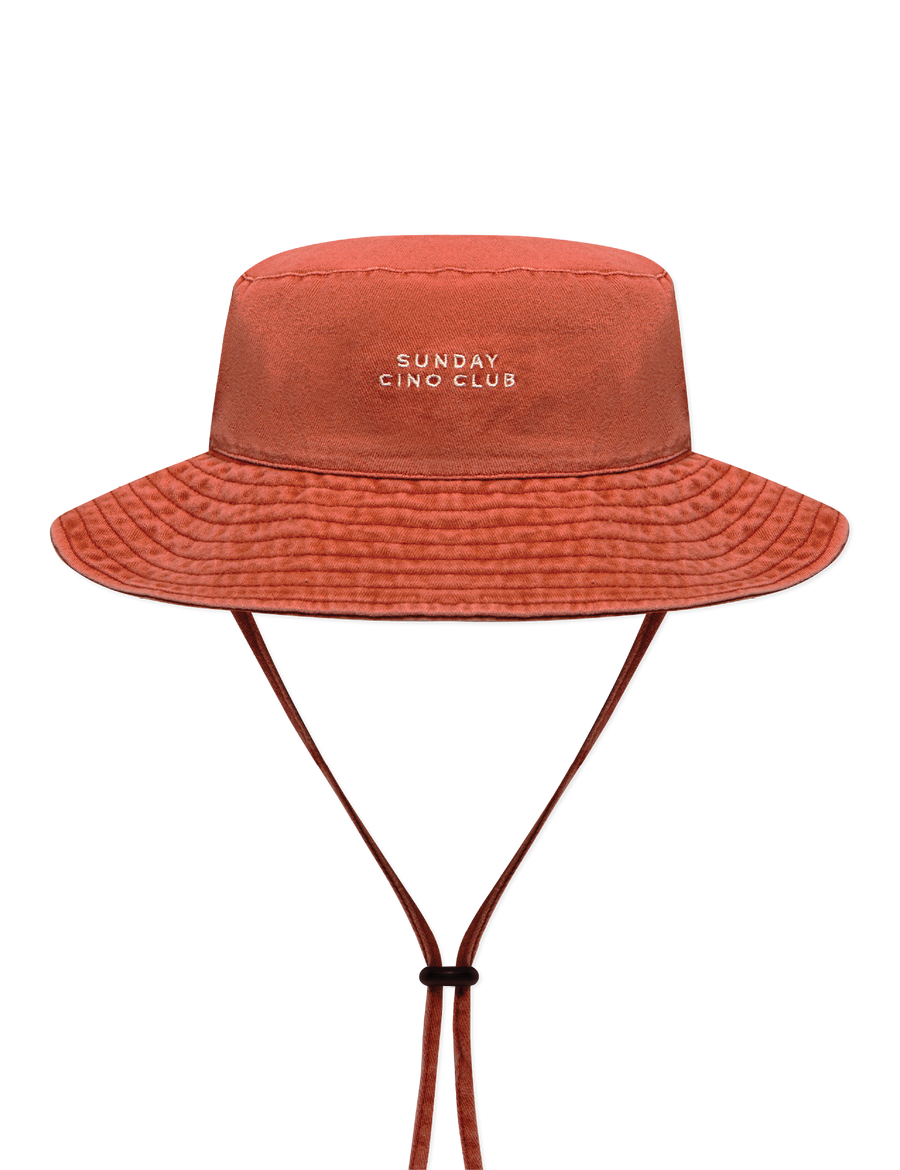 Sonny Label Sunday Club bucket hat flat lay on a grey background.
