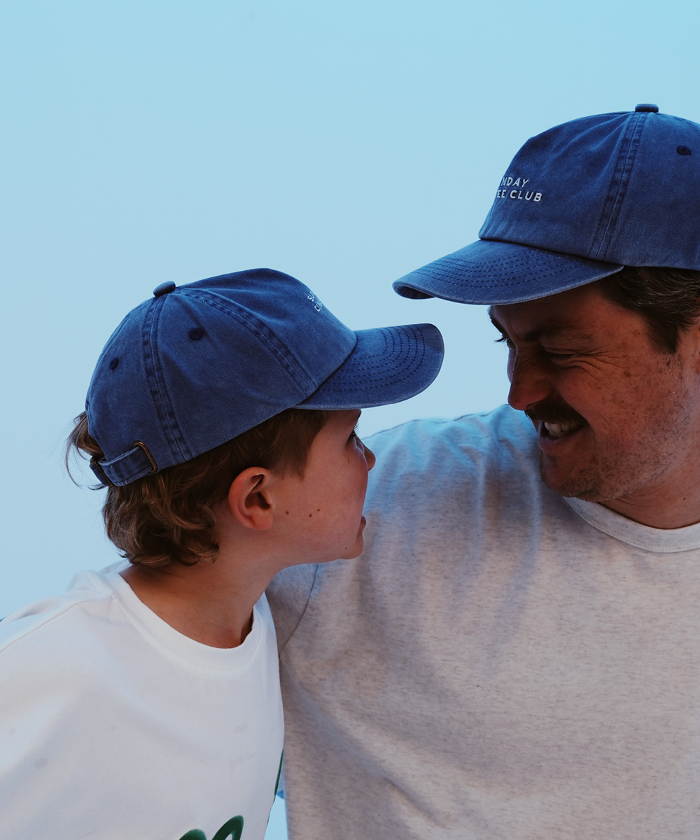 Child in Sonny Label Sunday Club cap. Variant upload.