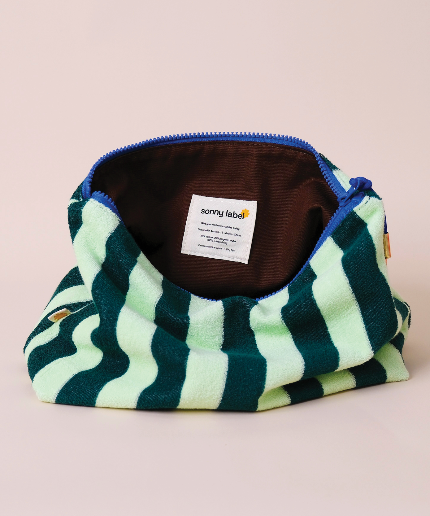 Sonny Label terrycloth zip pouch in a third colourway, laid flat on a neutral grey background.