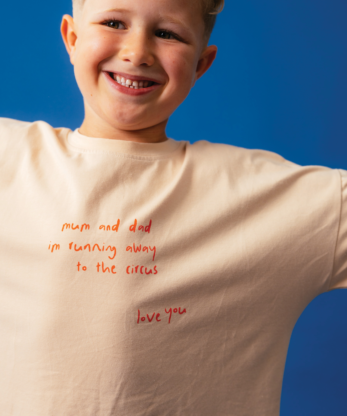 Child in Sonny Label Circus26 pieces on a vivid blue studio background. Variant upload.