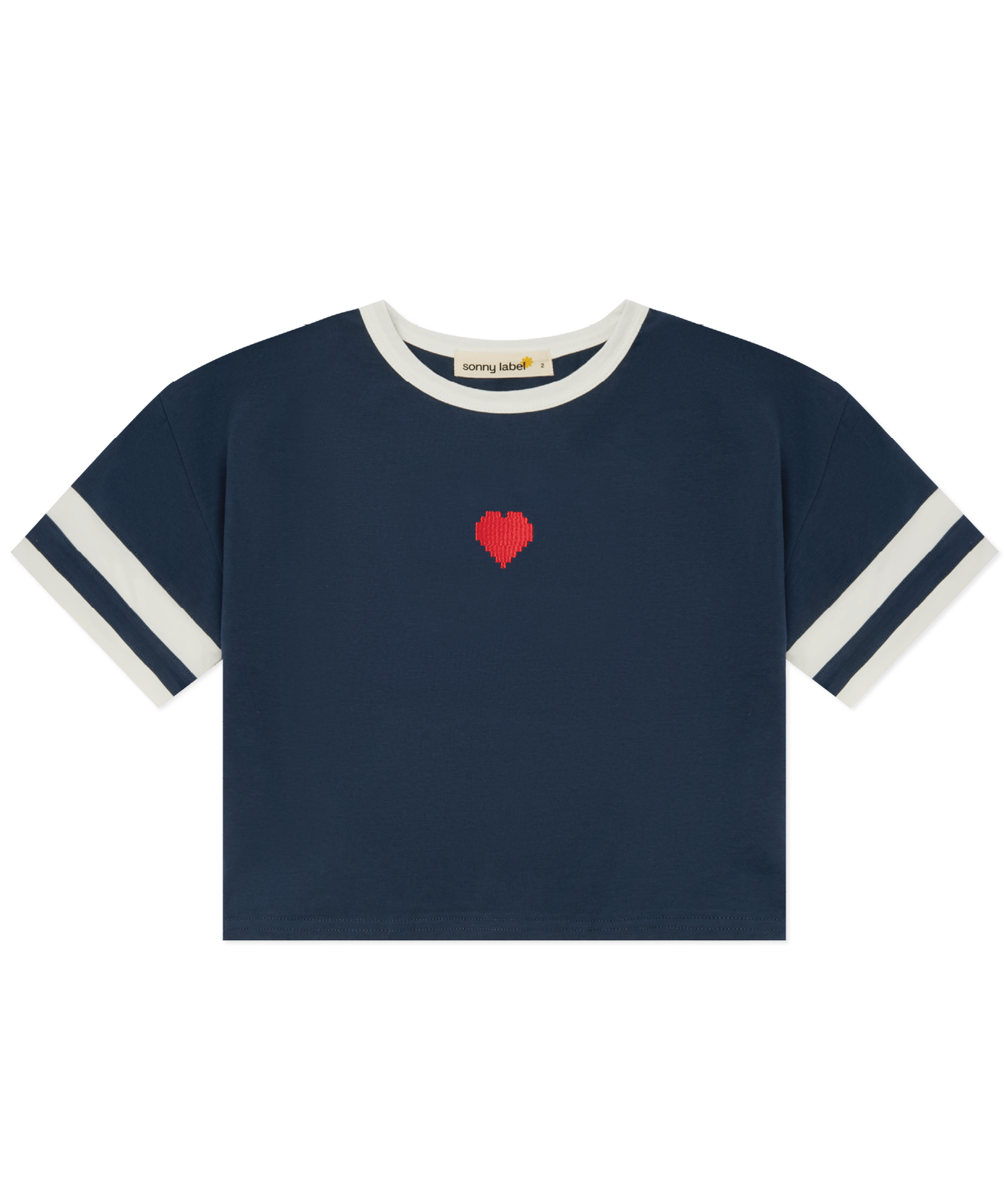 Child in Sonny Label LOVER collection outfit on a soft white studio background.