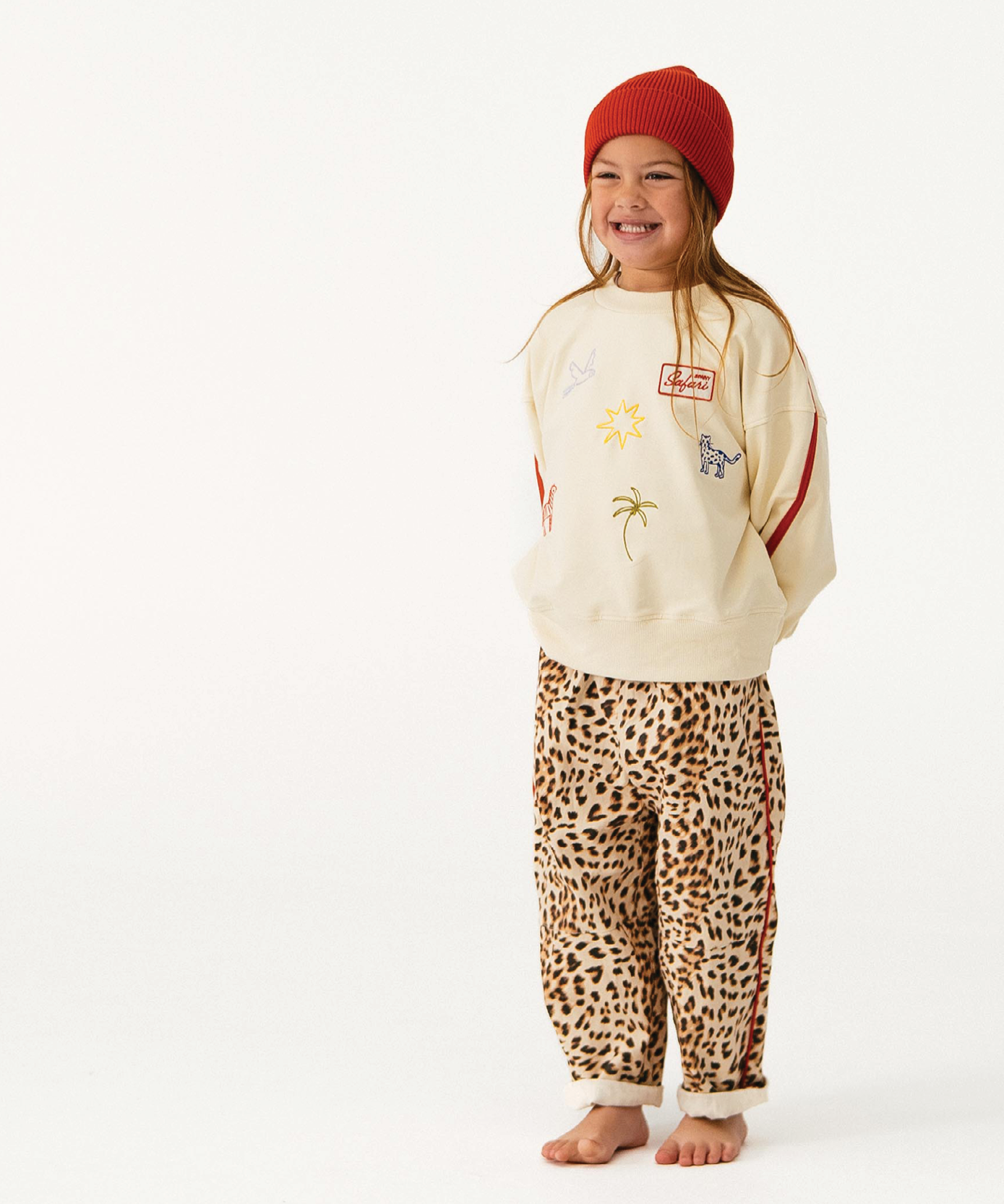 Child wearing Sonny Label Safari AW25 stripe long-sleeve tee and pants on a white background.